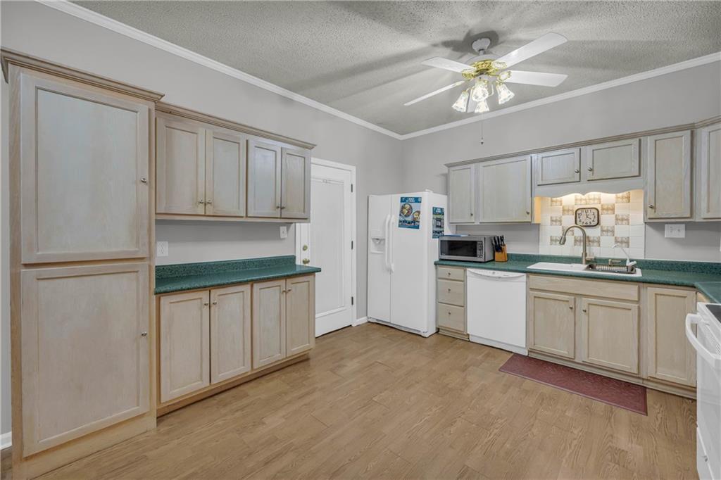 140 Breckenridge Lane Athens, GA 30606 - Photo 9 of 36 a kitchen with granite countertop white cabinets and white appliances