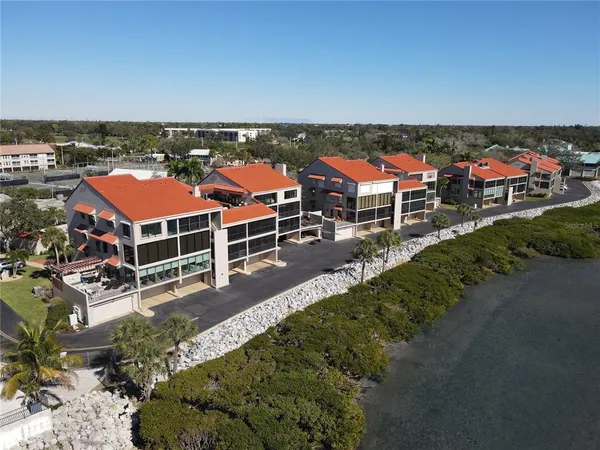 an aerial view of a house with a ocean view