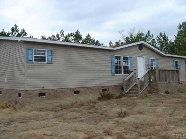14301 Quick Town Road Hamlet, NC 28345 - Photo 1 of 1 a backyard of a house