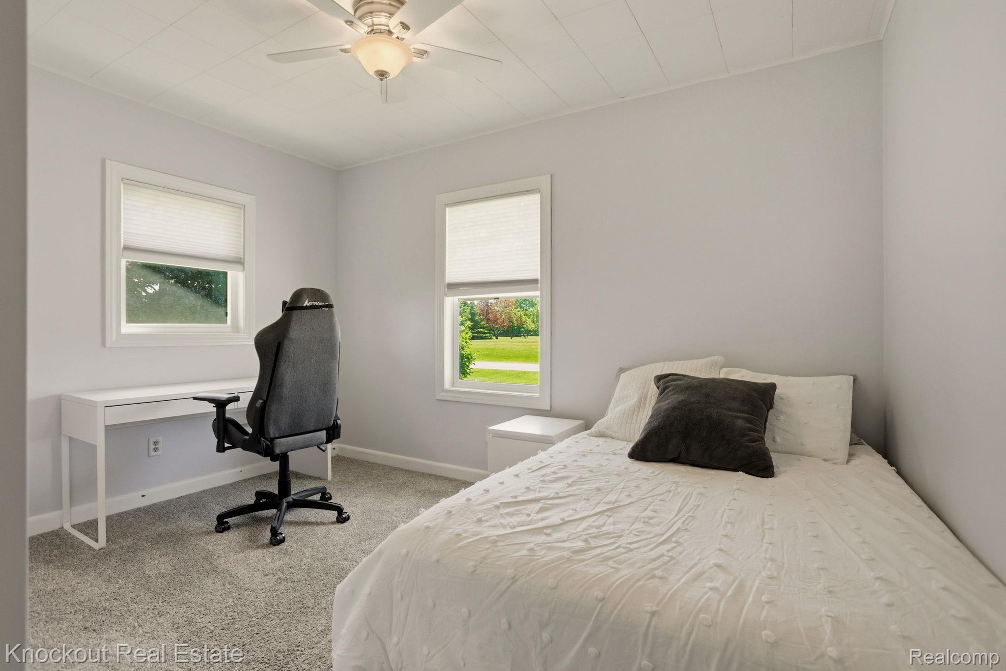 9941 Lange Road Birch Run, MI 48415 - Photo 29 of 42 Bright interior space featuring light gray walls, textured carpet flooring, and white trim around windows