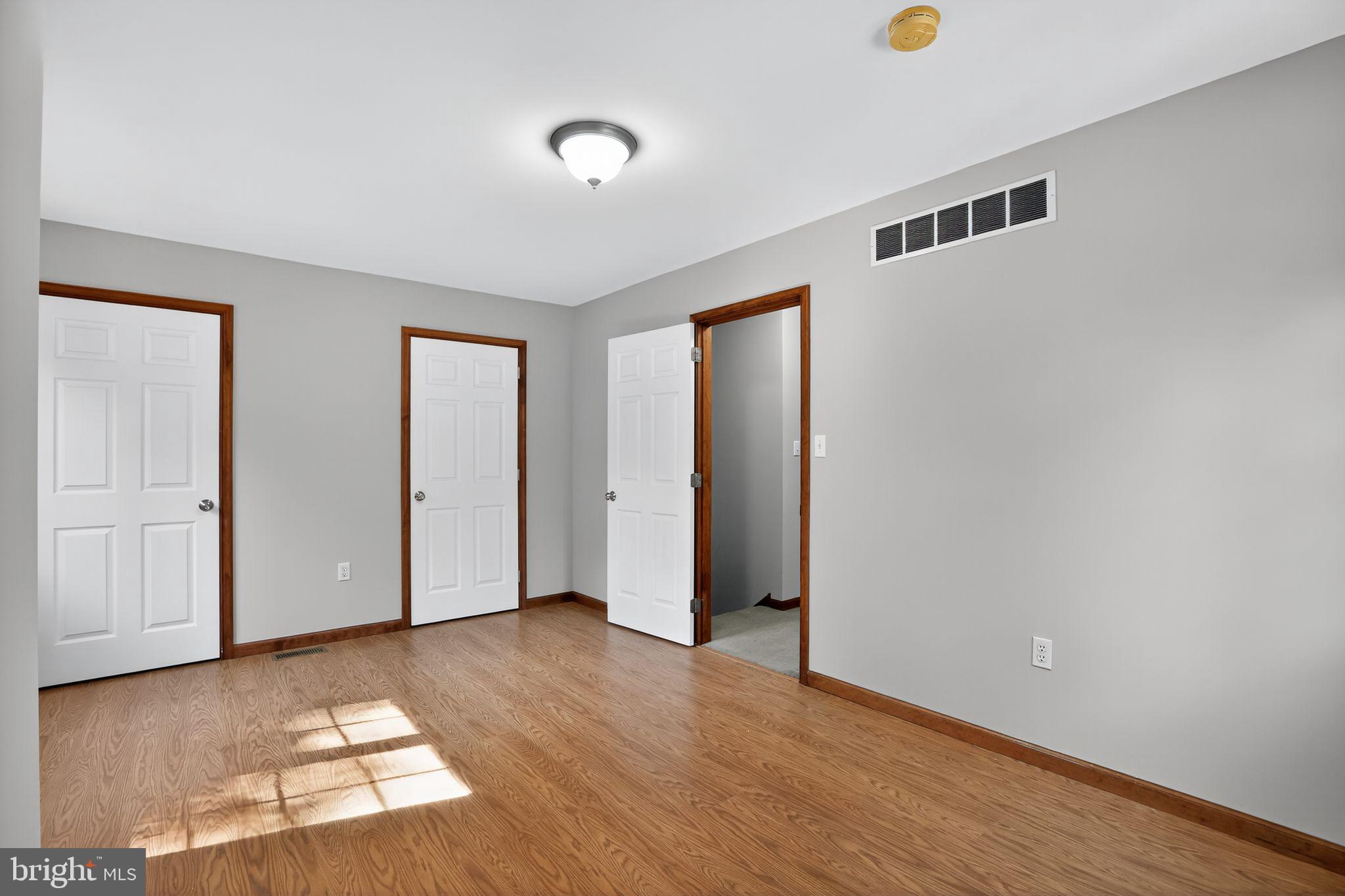 1709 Snyder Road Green Lane, PA 18054 - Photo 16 of 30 an empty room with wooden floor and windows