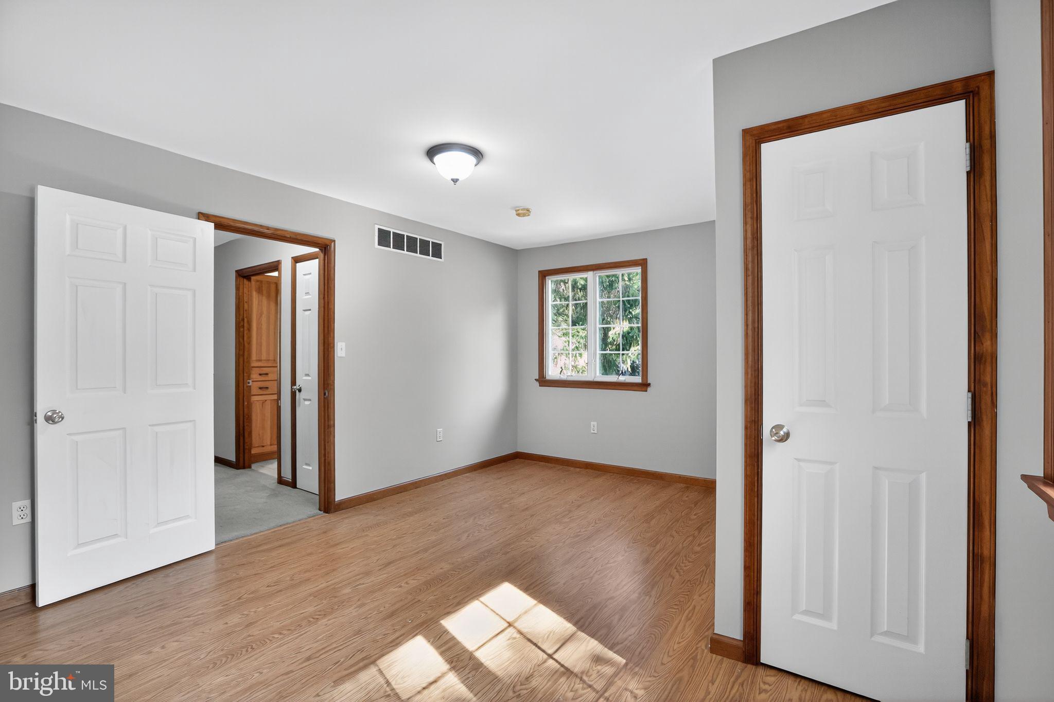 1709 Snyder Road Green Lane, PA 18054 - Photo 17 of 30 an empty room with wooden floor and a window