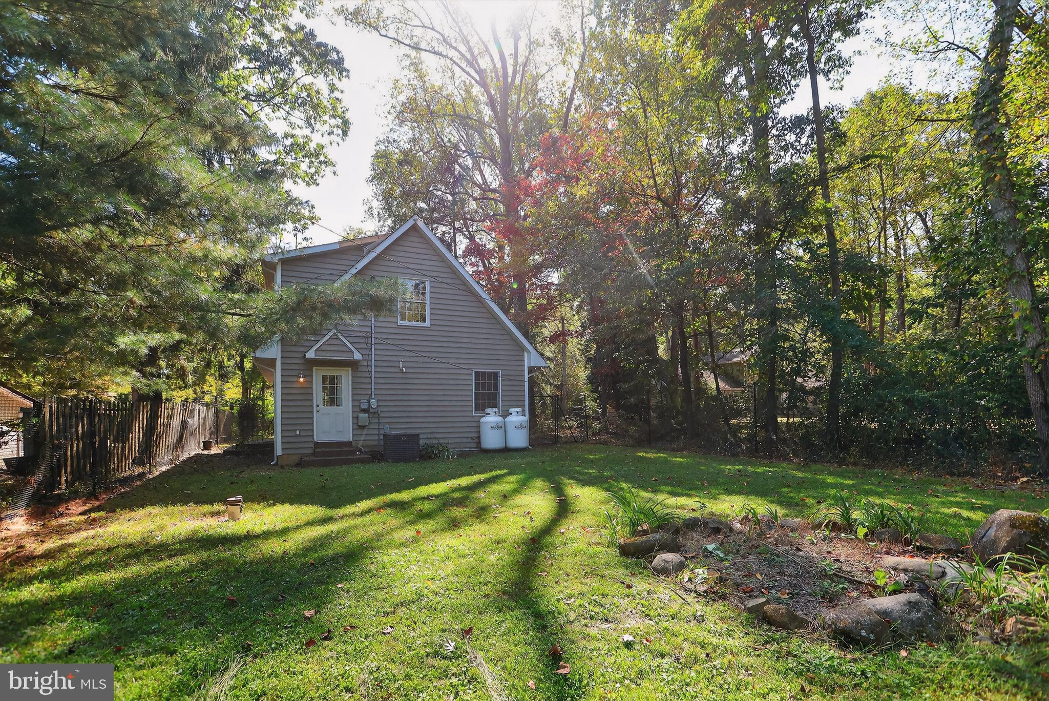 1709 Snyder Road Green Lane, PA 18054 - Photo 28 of 30 a view of a house with a yard and large tree