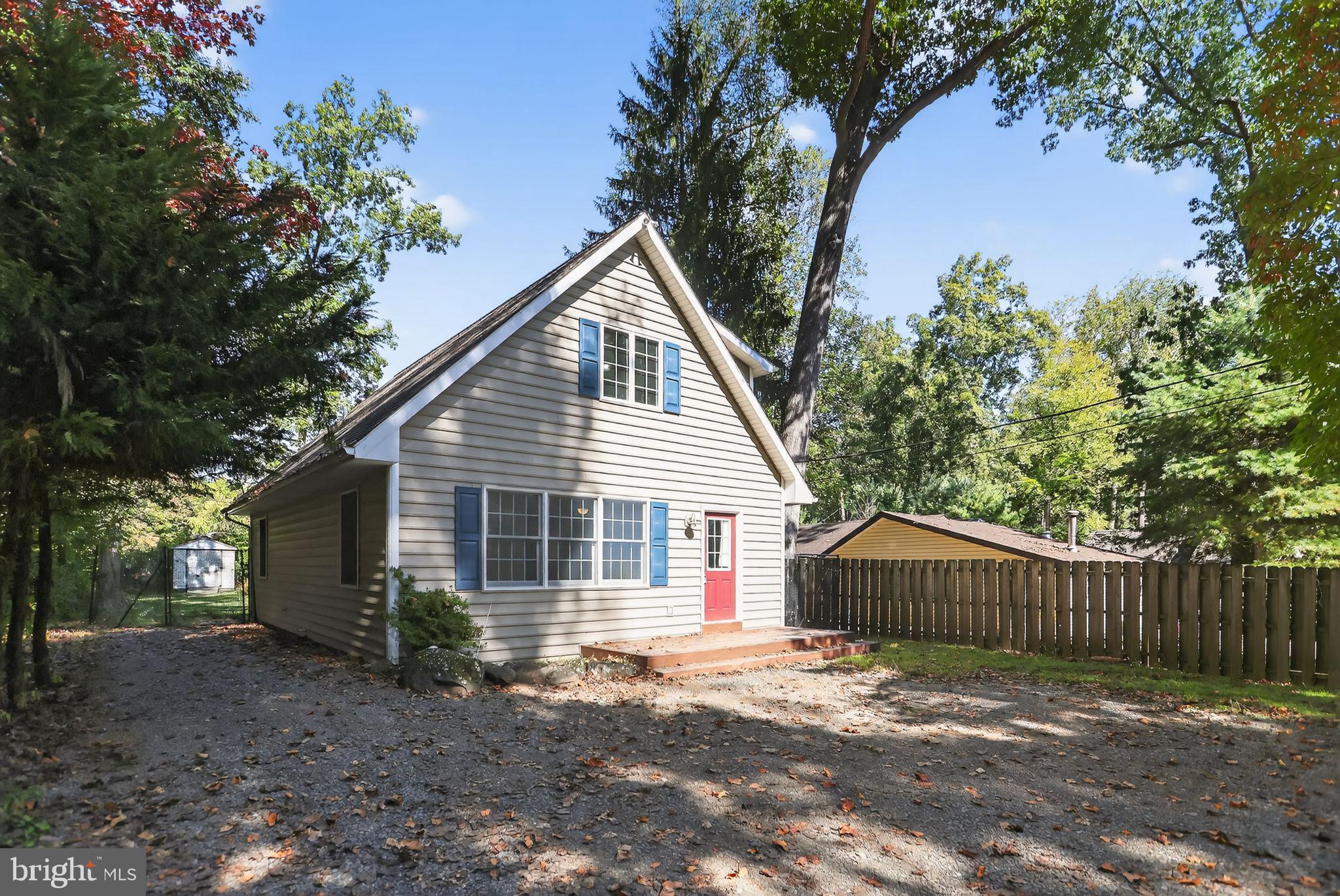 1709 Snyder Road Green Lane, PA 18054 - Photo 29 of 30 a view of a house with a yard plants and large tree