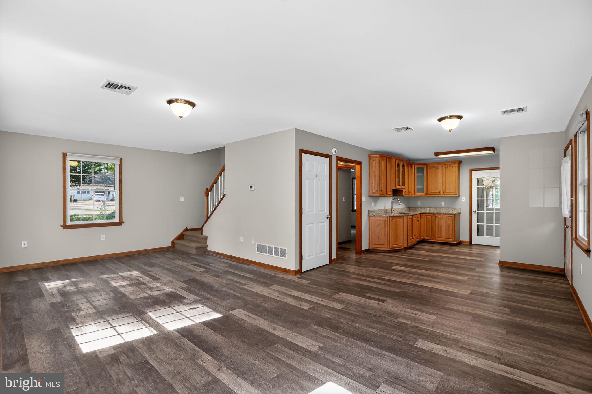 1709 Snyder Road Green Lane, PA 18054 - Photo 3 of 30 a view of a livingroom with wooden floor and windows
