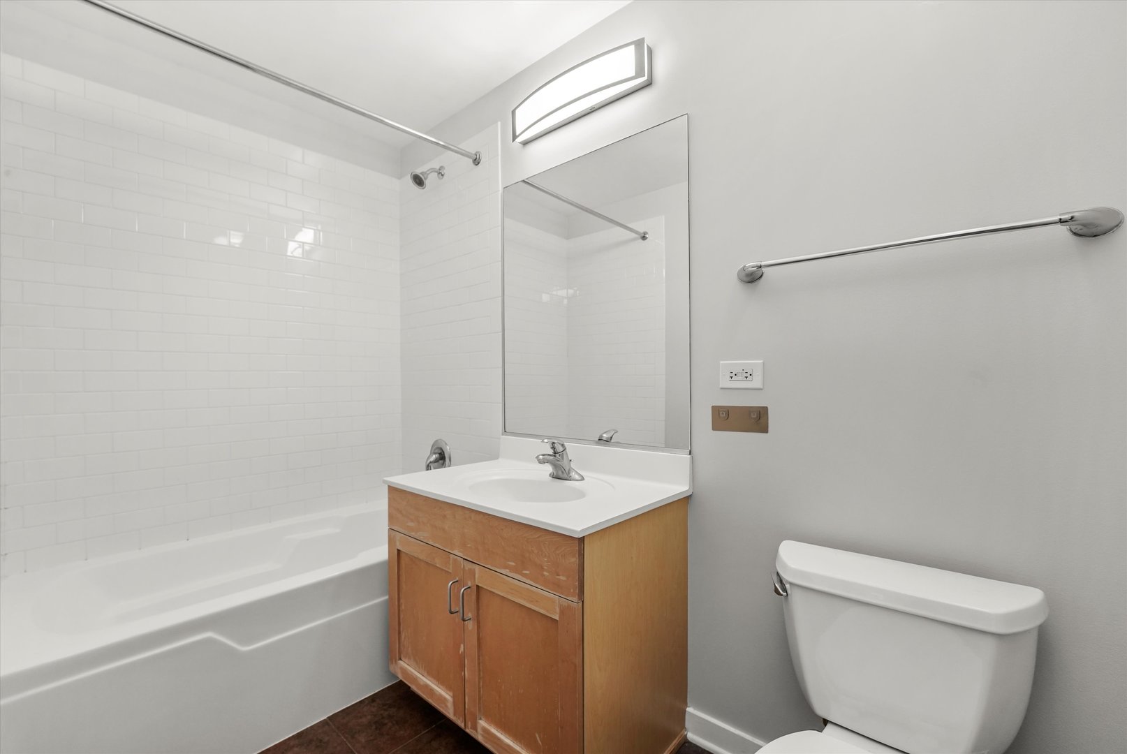 1075 West Roosevelt Road, Unit 206 Chicago, IL 60608 - Photo 12 of 17 a bathroom with a sink toilet and shower