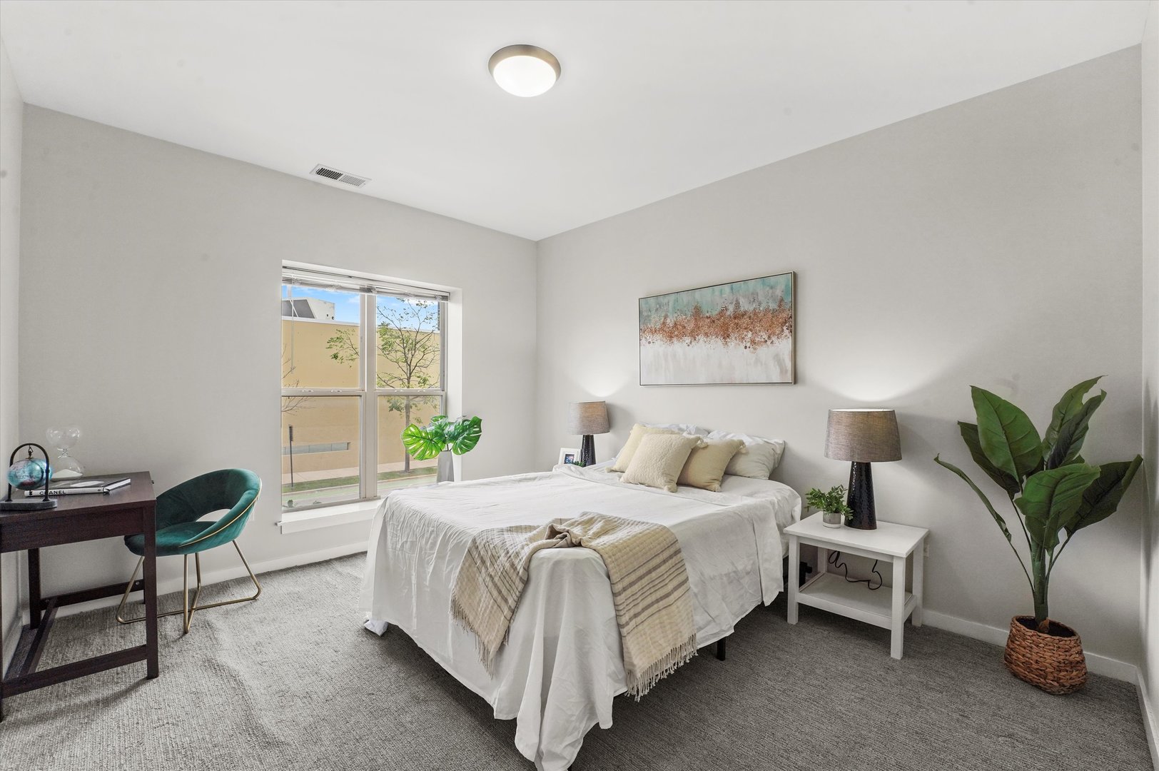 1075 West Roosevelt Road, Unit 206 Chicago, IL 60608 - Photo 9 of 17 a bedroom with a bed and a potted plant