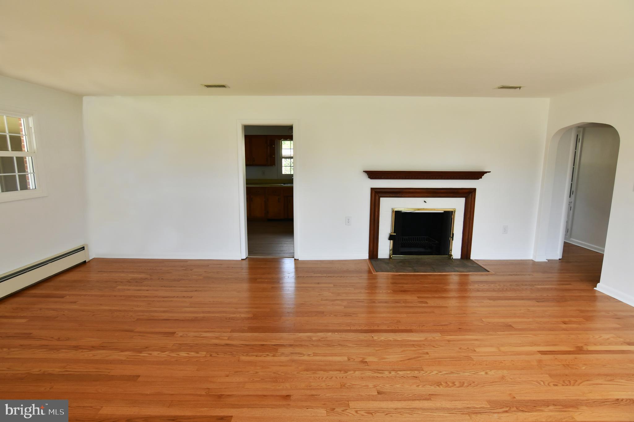 437 Beechcroft Road Winchester, VA 22601 - Photo 15 of 52 a view of empty room with wooden floor and fireplace