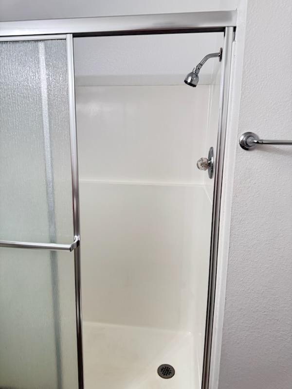5126 East Monte Vista Road Phoenix, AZ 85008 - Photo 15 of 22 a bathroom with a glass shower door