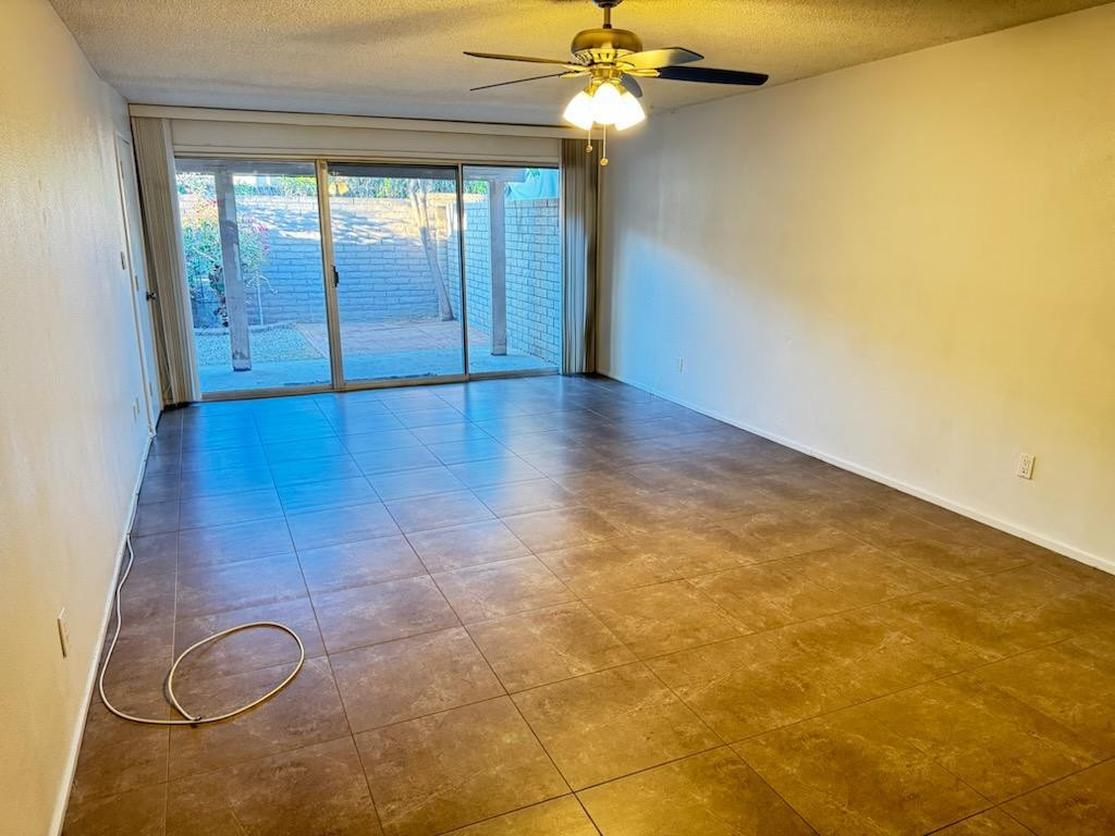 5126 East Monte Vista Road Phoenix, AZ 85008 - Photo 7 of 22 wooden floor in an empty room with a window