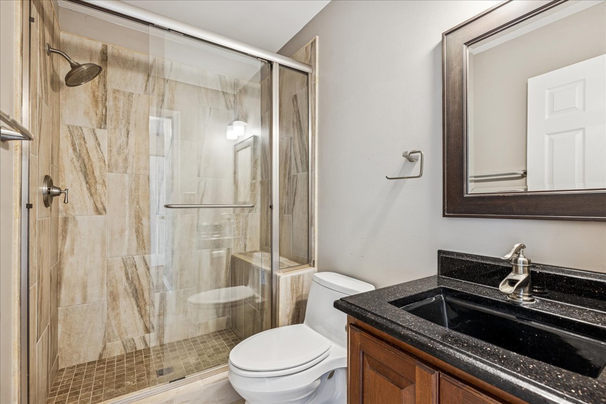 2308 Loop Road Algonquin, IL 60102 - Photo 17 of 73 a bathroom with a sink toilet and shower