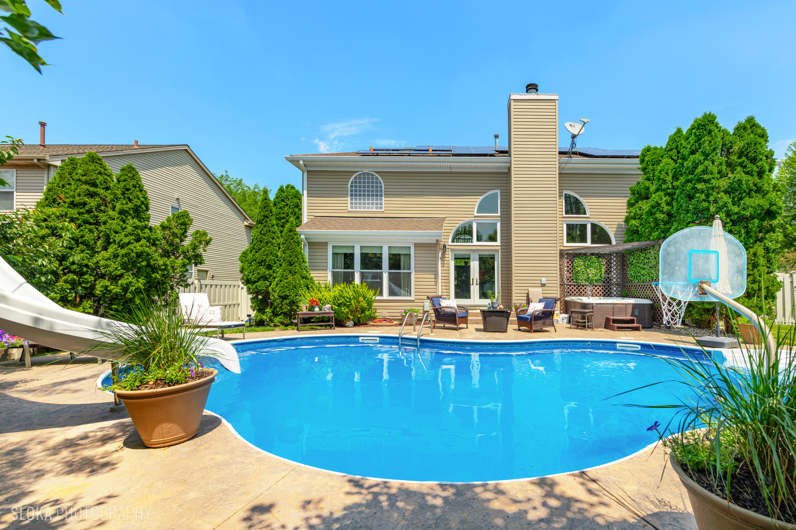 2308 Loop Road Algonquin, IL 60102 - Photo 2 of 73 a view of a house with backyard sitting area and swimming pool