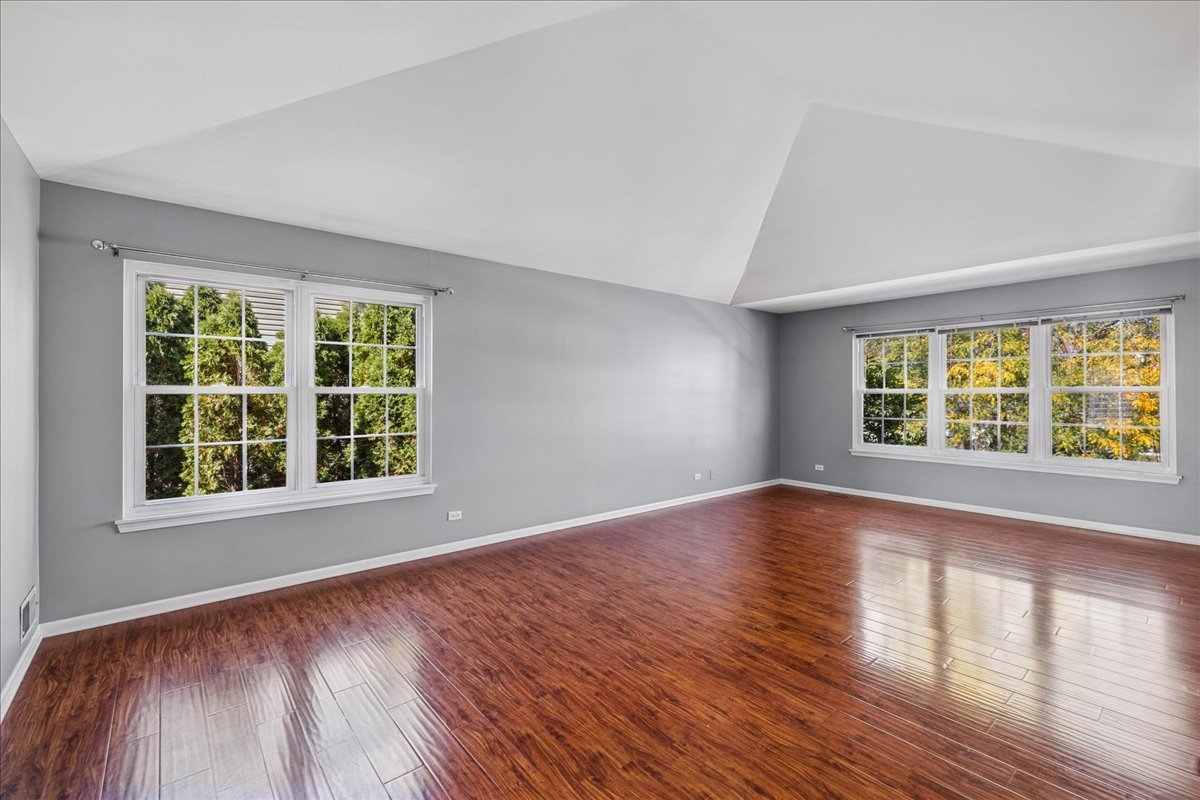 2308 Loop Road Algonquin, IL 60102 - Photo 21 of 73 an empty room with wooden floor and windows