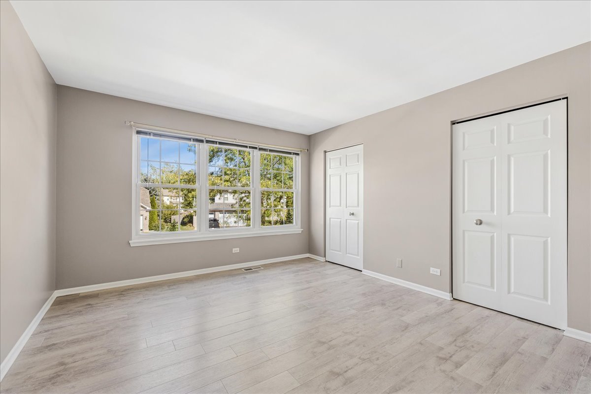 2308 Loop Road Algonquin, IL 60102 - Photo 27 of 73 an empty room with windows and closet