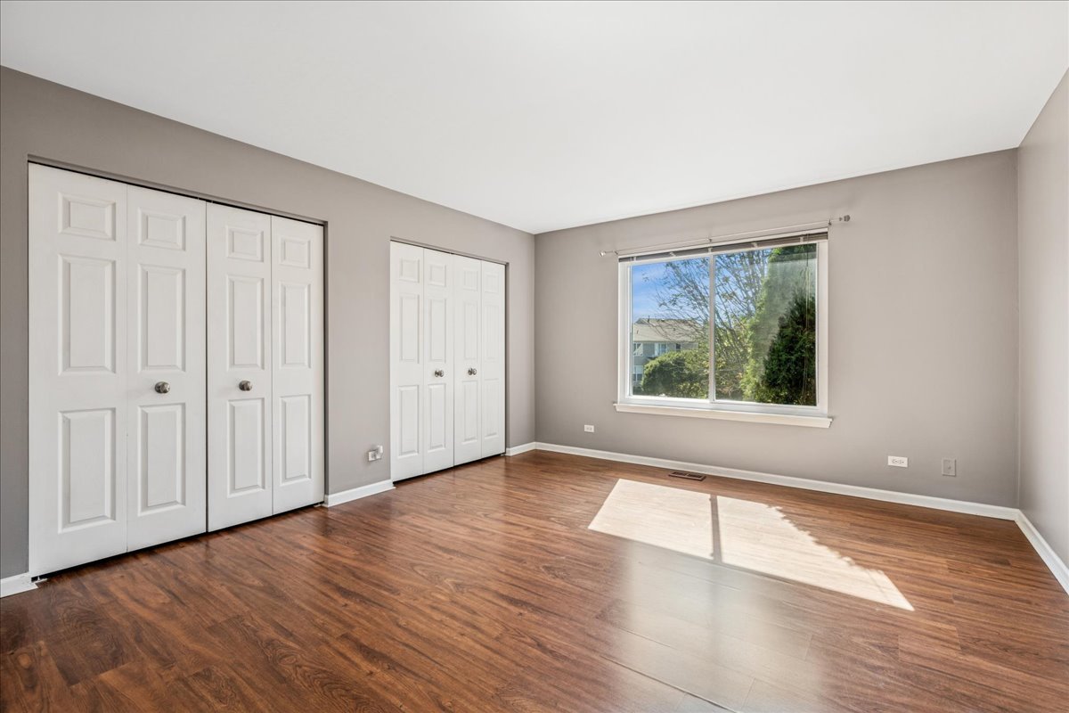 2308 Loop Road Algonquin, IL 60102 - Photo 29 of 73 a view of an empty room with wooden floor and a window