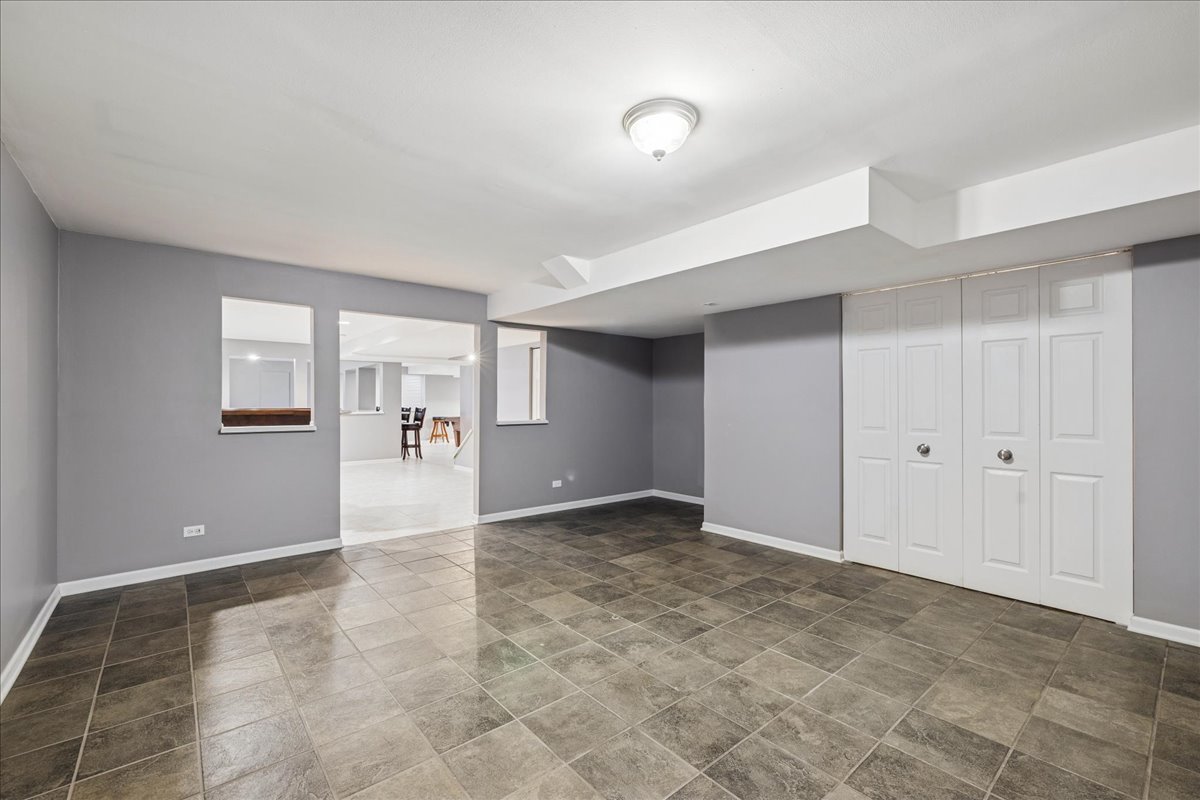 2308 Loop Road Algonquin, IL 60102 - Photo 34 of 73 a view of a big room with wooden floor and a bathroom