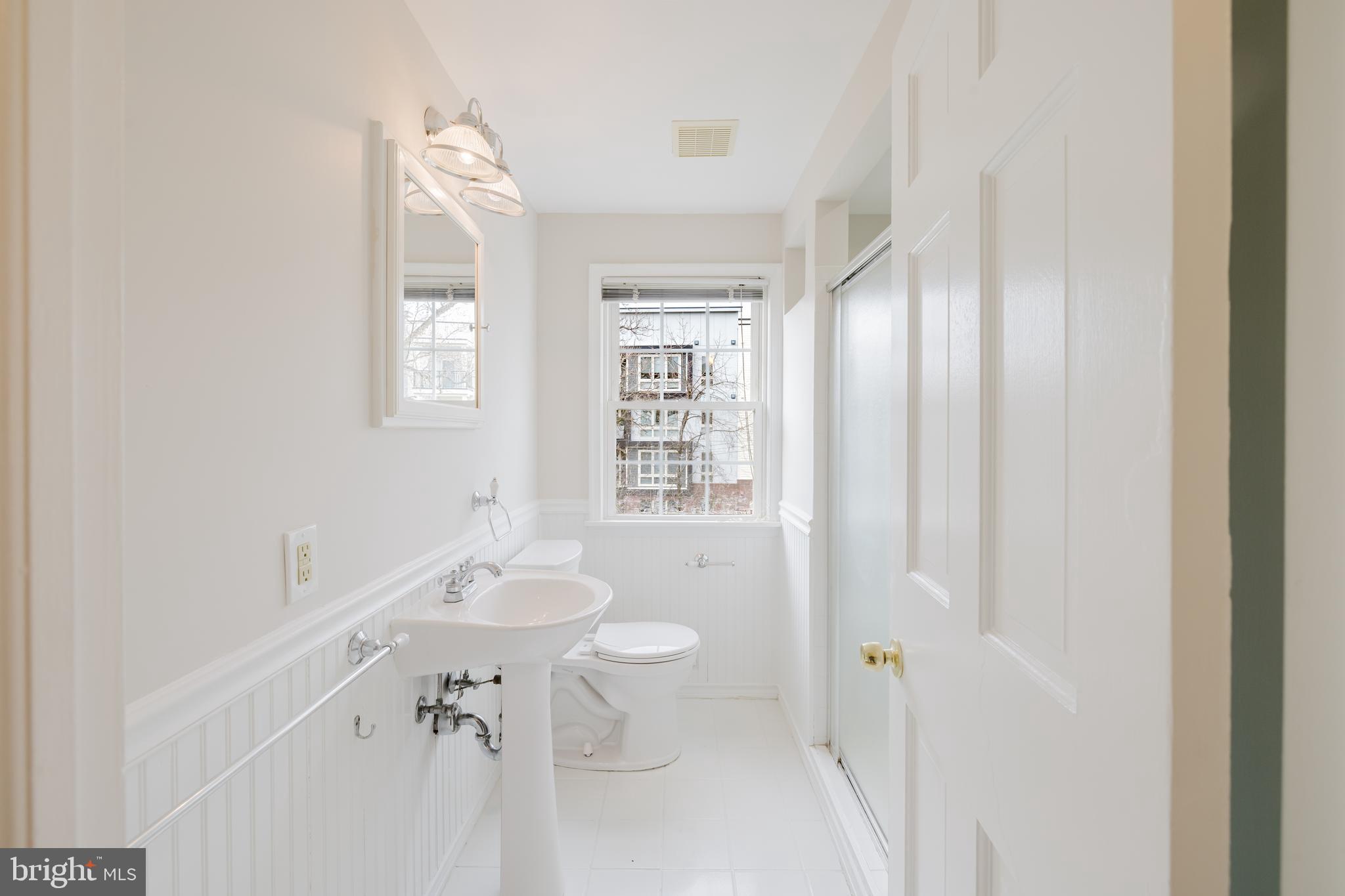 904 Locustvale Road Towson, MD 21204 - Photo 14 of 29 a bathroom with a sink toilet and shower