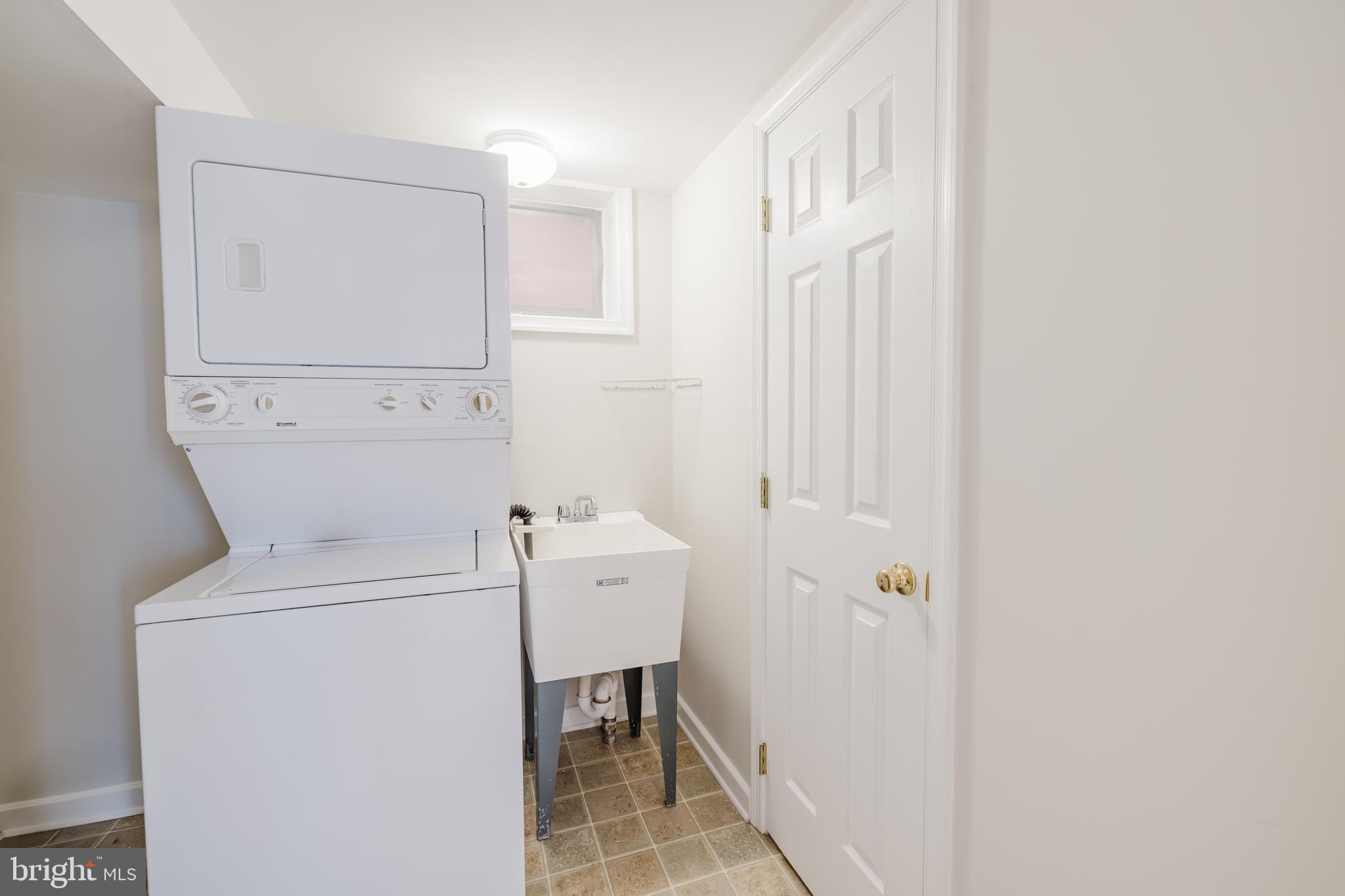 904 Locustvale Road Towson, MD 21204 - Photo 19 of 29 a view of bathroom with a washer and dryer