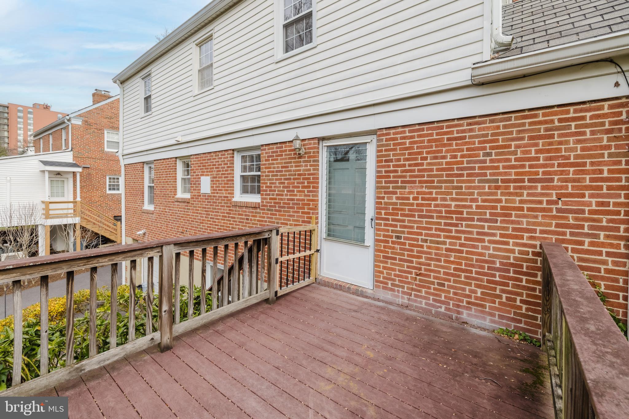 904 Locustvale Road Towson, MD 21204 - Photo 21 of 29 a view of a brick house with wooden deck