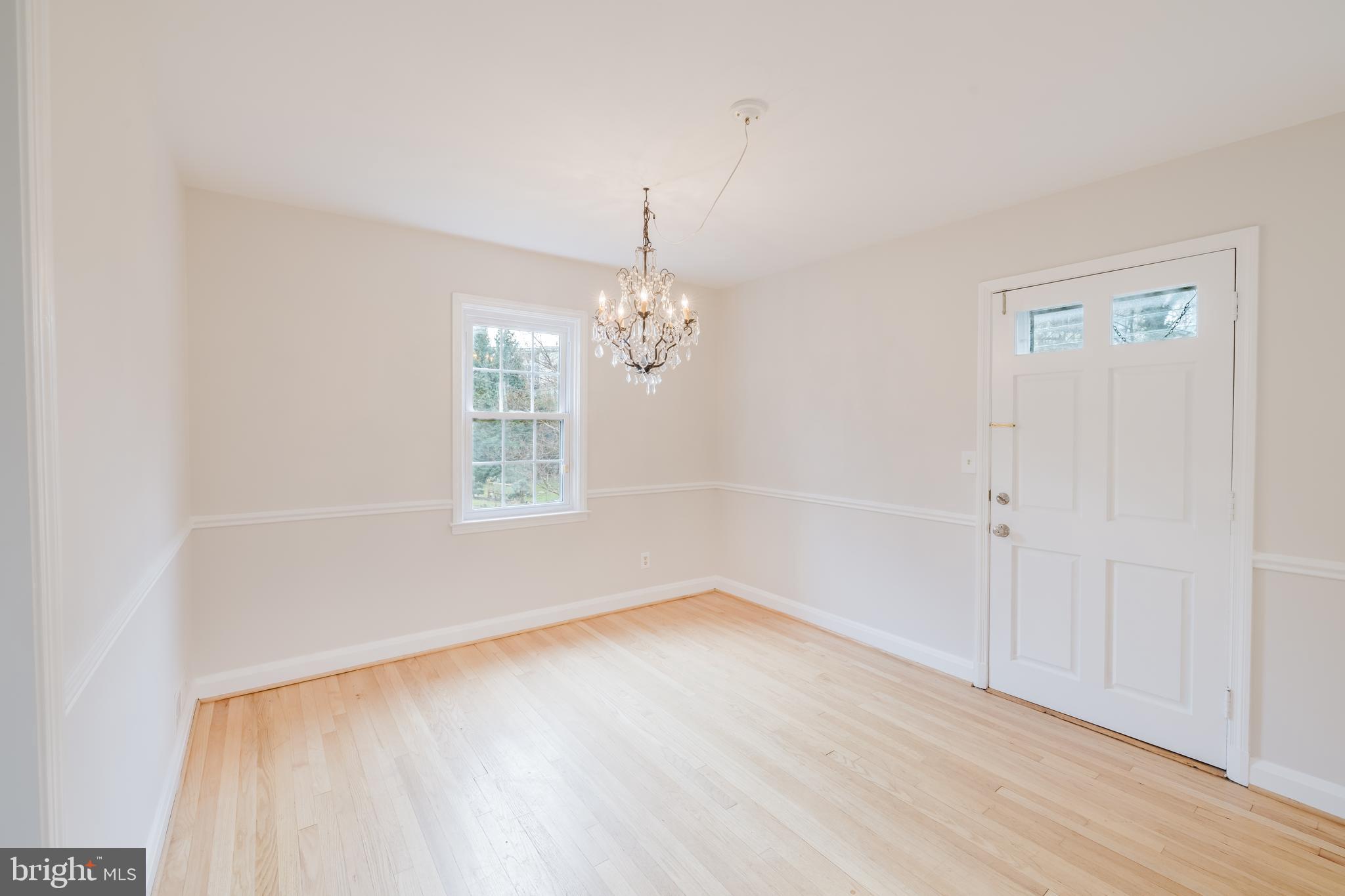 904 Locustvale Road Towson, MD 21204 - Photo 6 of 29 wooden floor in an empty room with a window