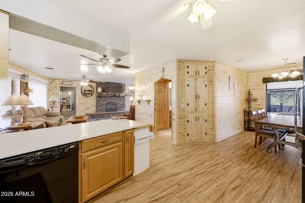 a room with wooden floor and large window