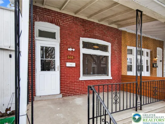 a front view of a house with a glass door