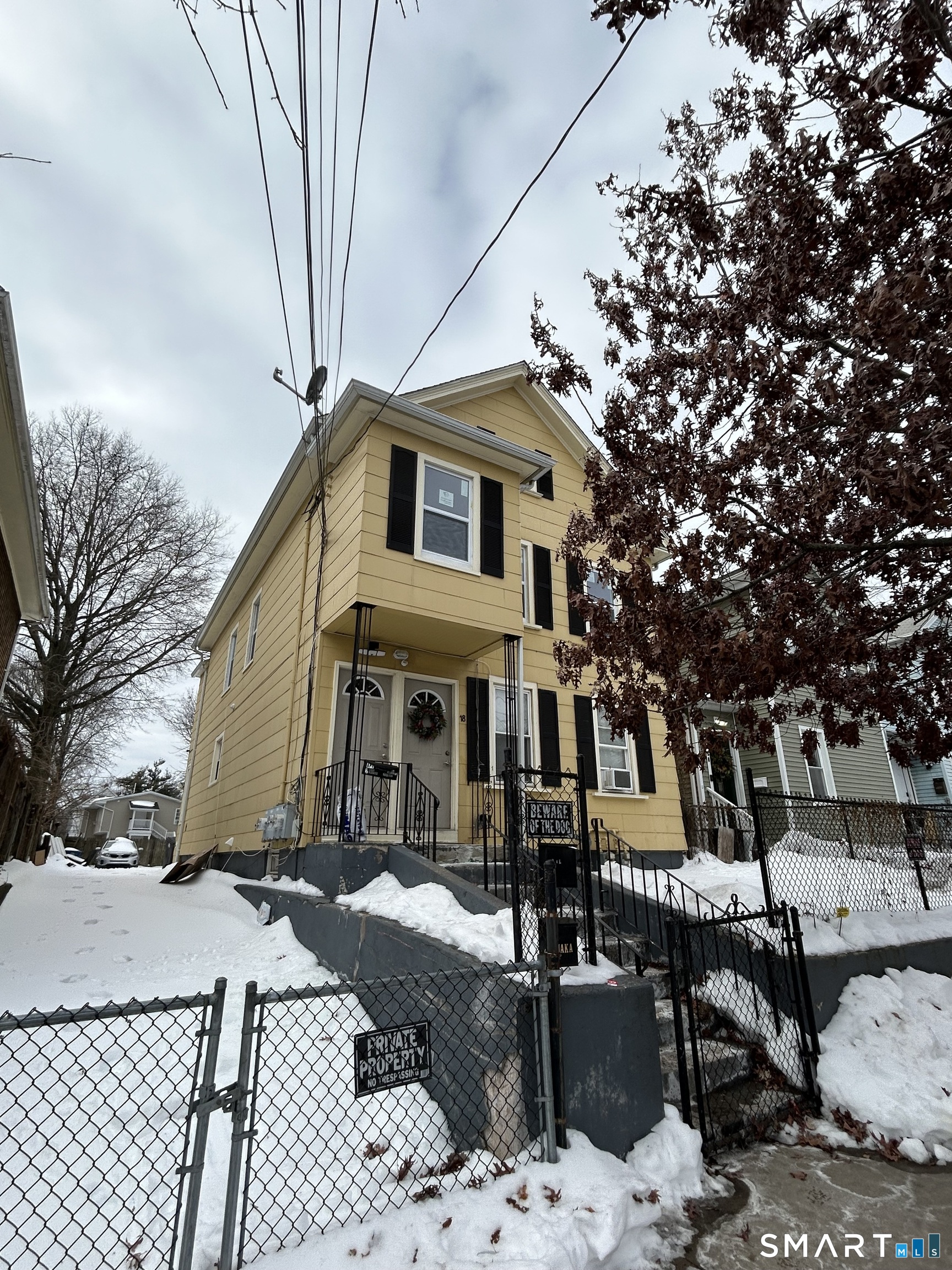 18 Wilson Street, Unit 2 New Haven, CT 06519 - Photo 1 of 17 a front view of a house with a yard