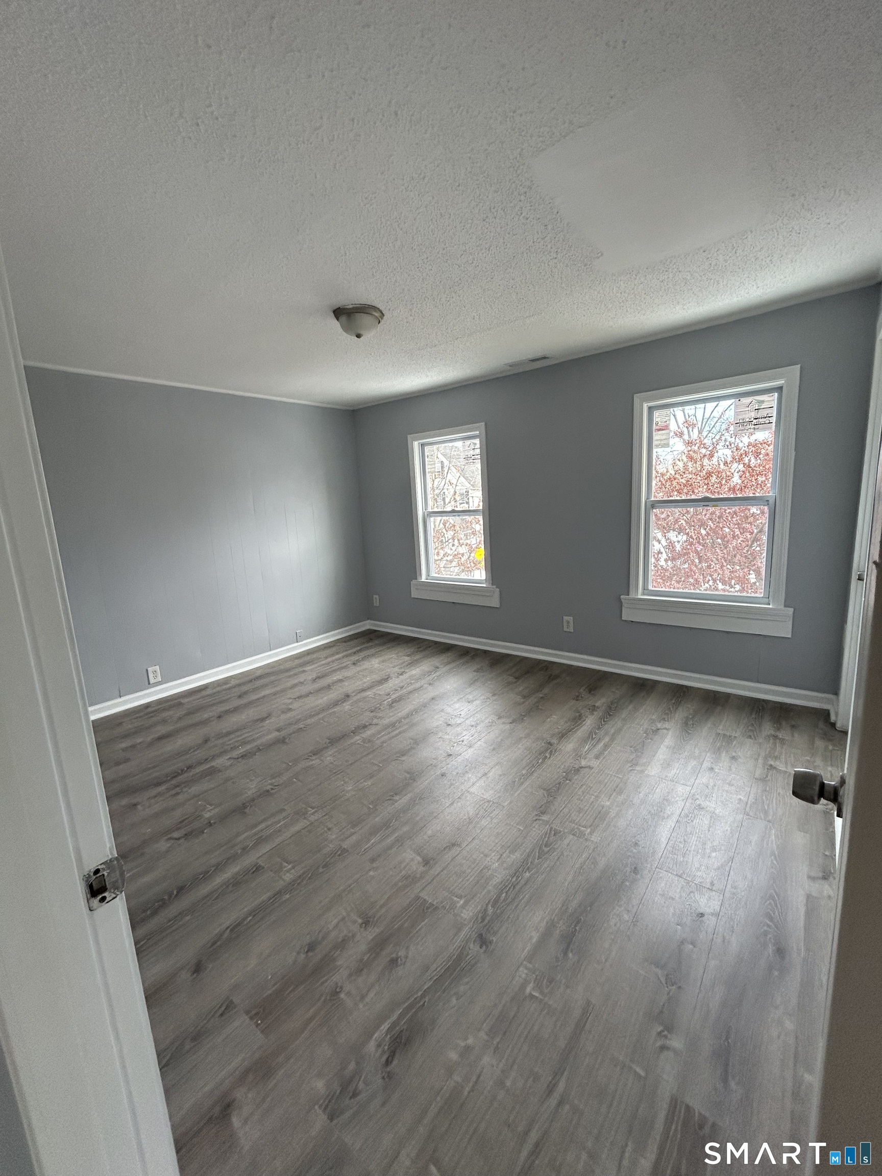 18 Wilson Street, Unit 2 New Haven, CT 06519 - Photo 6 of 17 wooden floor in an empty room with a window