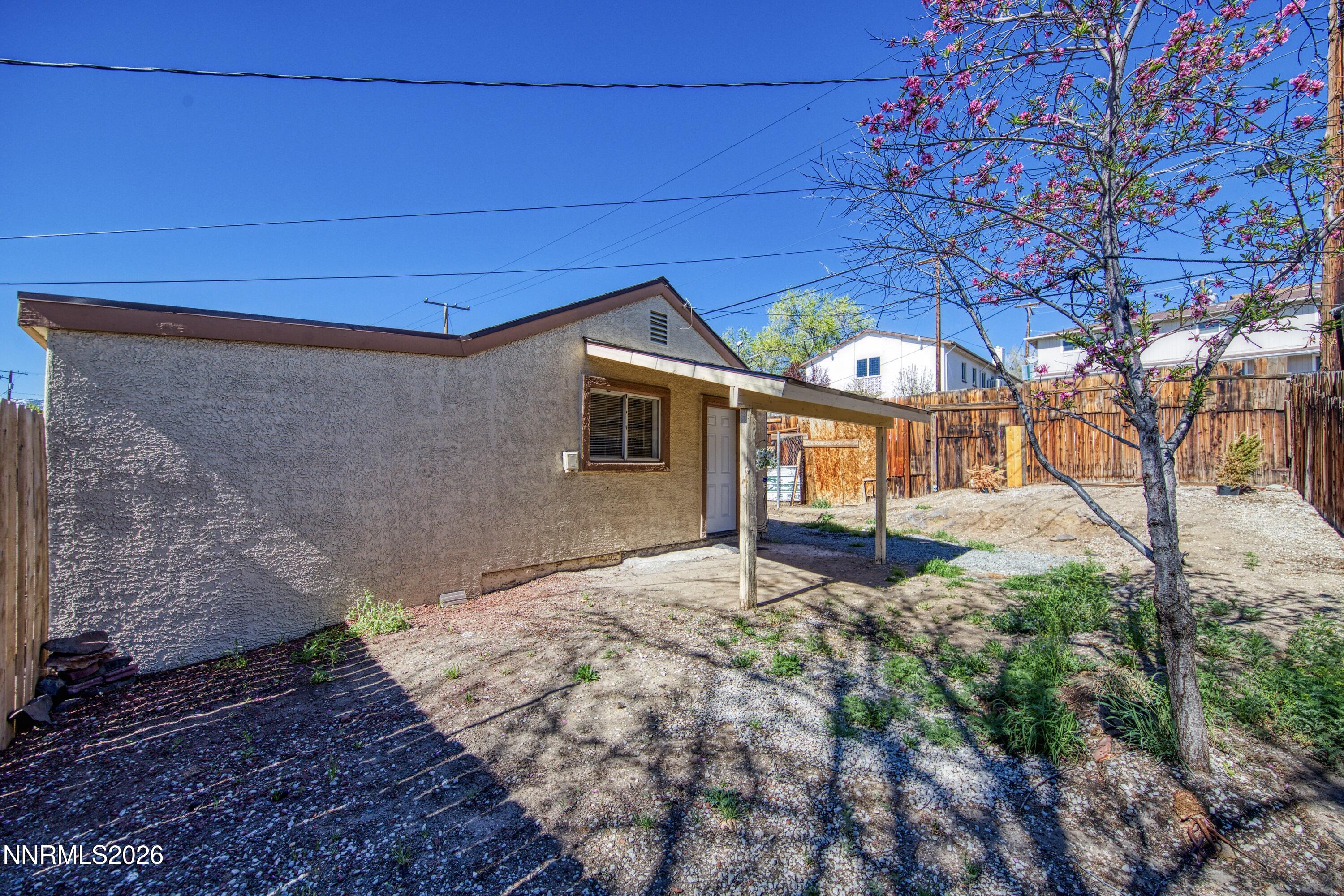 1939 Wilder Street Reno, NV 89512 - Photo 20 of 28 a front view of a house with a yard