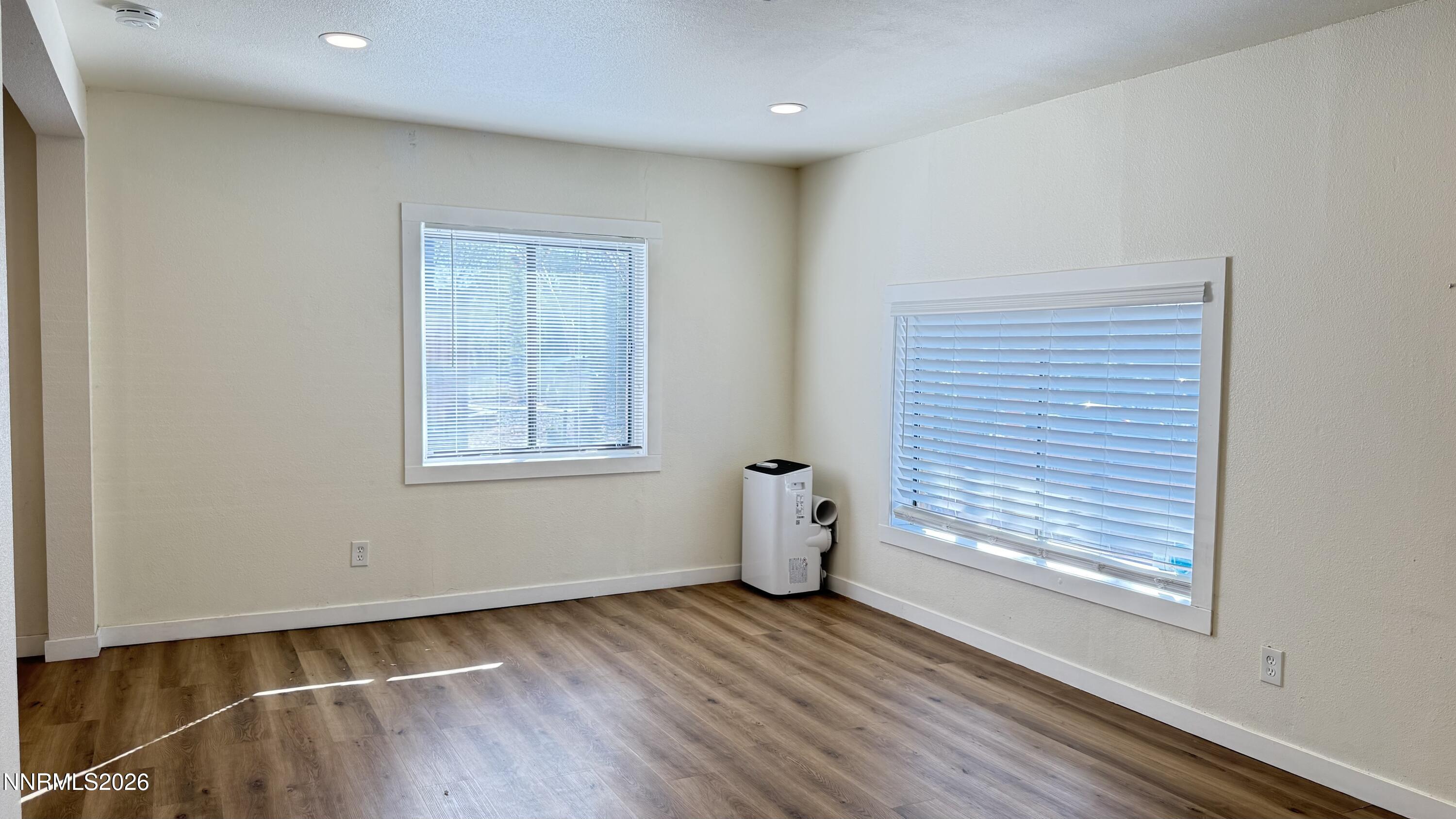 1939 Wilder Street Reno, NV 89512 - Photo 9 of 28 a view of a room with wooden floor and window