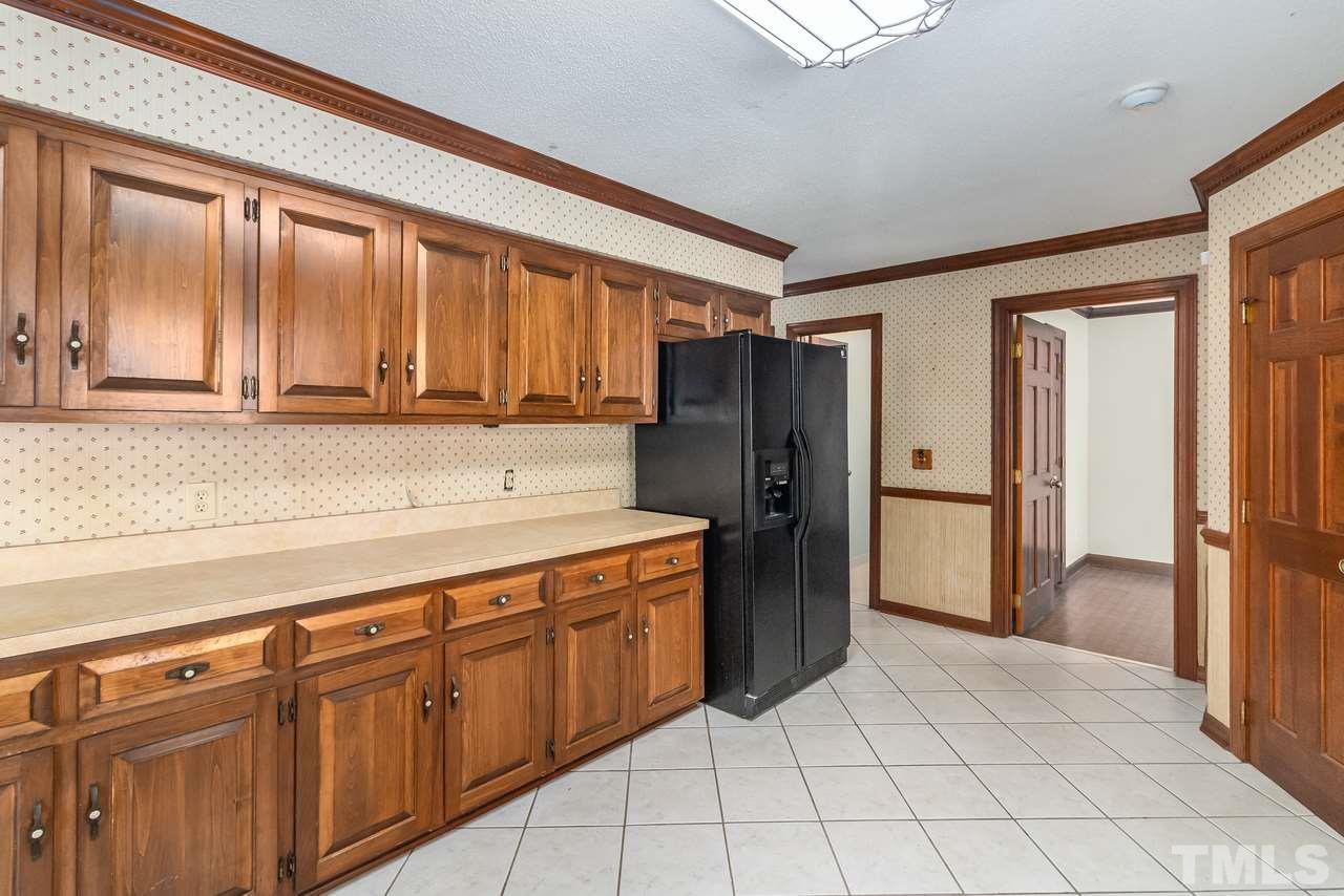 11600 Appaloosa Run West Raleigh, NC 27613 - Photo 8 of 30 a kitchen with stainless steel appliances granite countertop a refrigerator and a sink