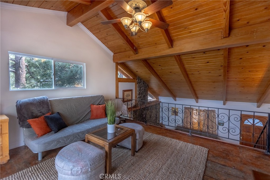 5218 Desert View Drive Wrightwood, CA 92397 - Photo 34 of 50 a living room with furniture and a wooden floor