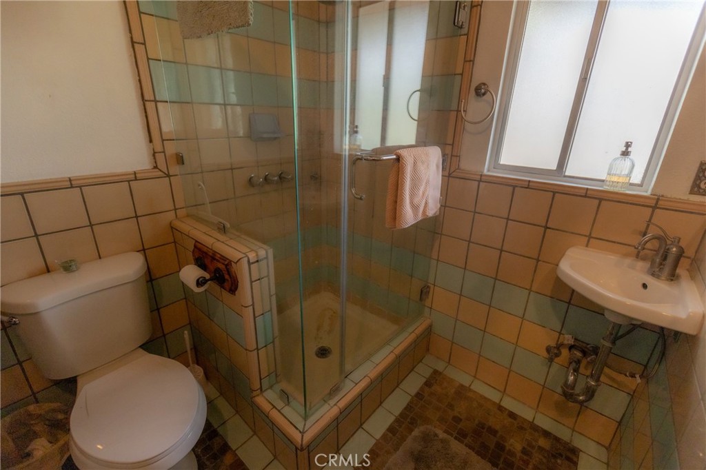 5218 Desert View Drive Wrightwood, CA 92397 - Photo 36 of 50 a bathroom with a sink toilet and shower