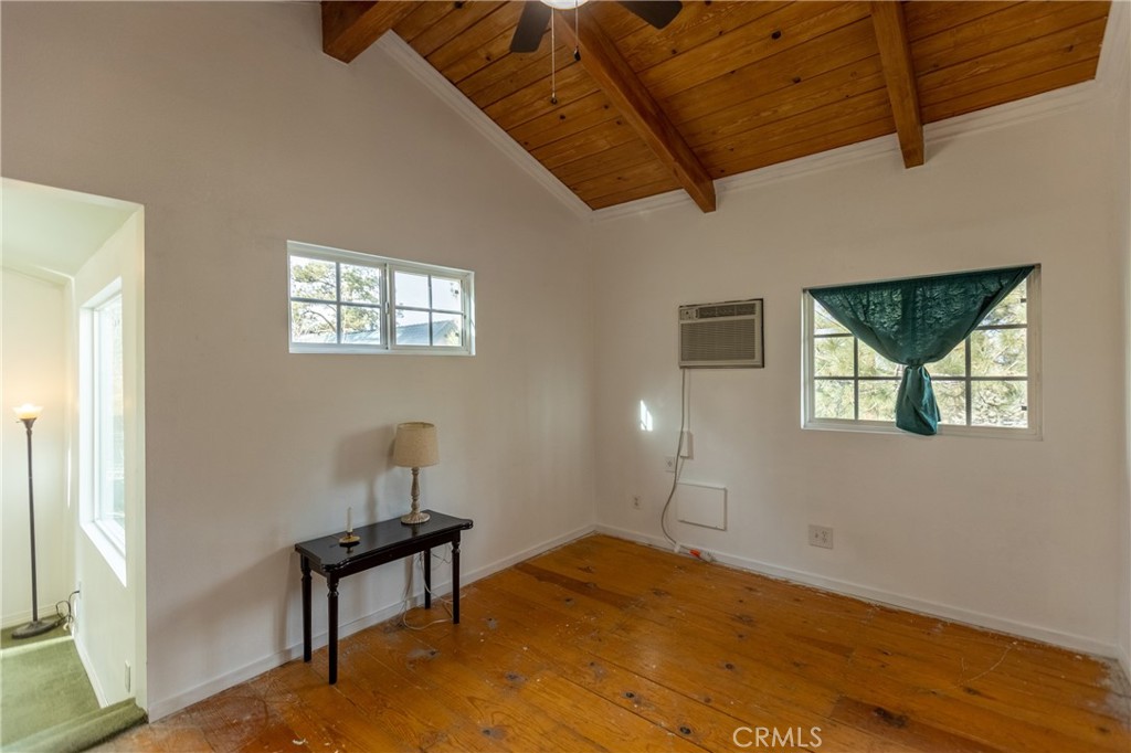 5218 Desert View Drive Wrightwood, CA 92397 - Photo 38 of 50 a bedroom with furniture and a window