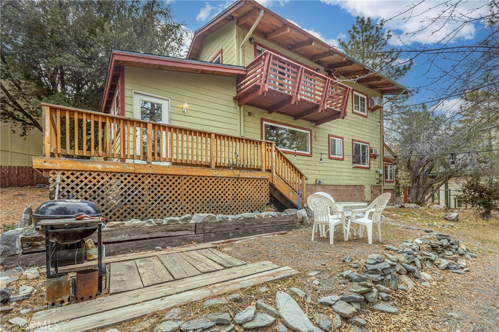 5218 Desert View Drive Wrightwood, CA 92397 - Photo 43 of 50 a view of a patio with a table and chairs