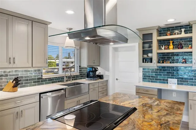 a view of a dining room with furniture a chandelier and wooden floor