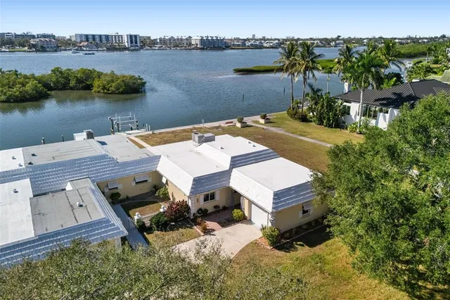 an aerial view of a house with lake view
