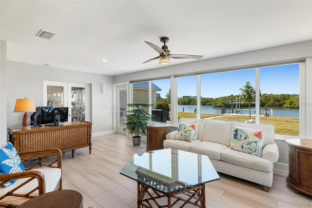 a bed room with a bed and a chair