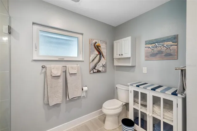 a bedroom with a bed and a night stand