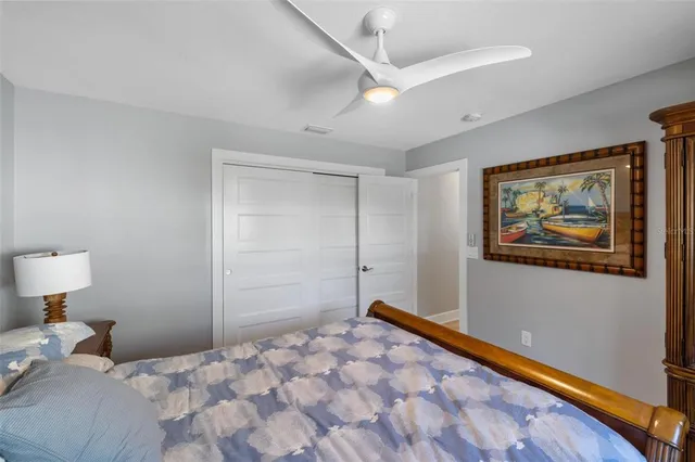 a view of room with a window and a ceiling fan