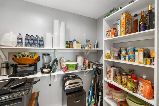 a front view of a house with a garden and parking