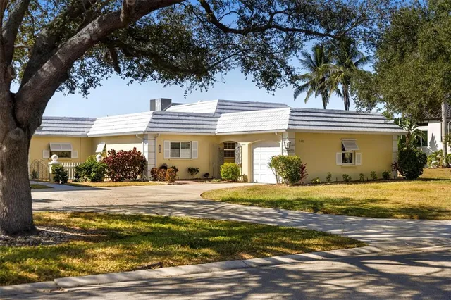 an aerial view of a house with a lake view