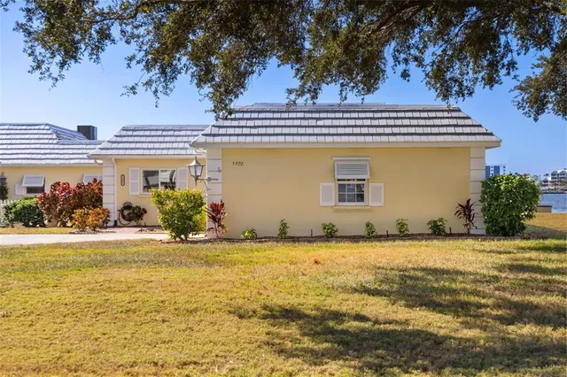 an aerial view of a houses with ocean view