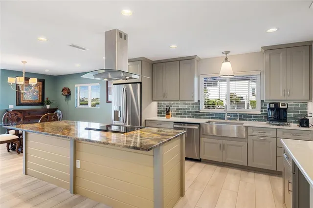 a view of a dining room with furniture wooden floor and chandelier