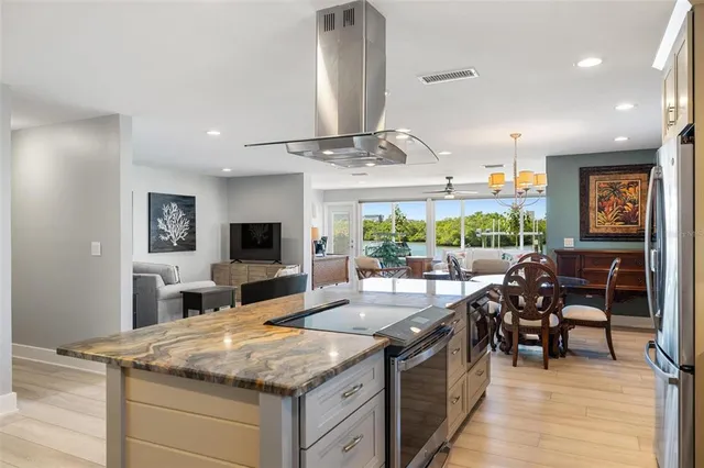 a kitchen with a sink a stove and cabinets