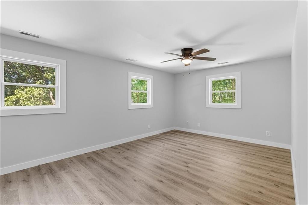 96 Collins Road Rome, GA 30161 - Photo 31 of 57 wooden floor in an empty room with a window