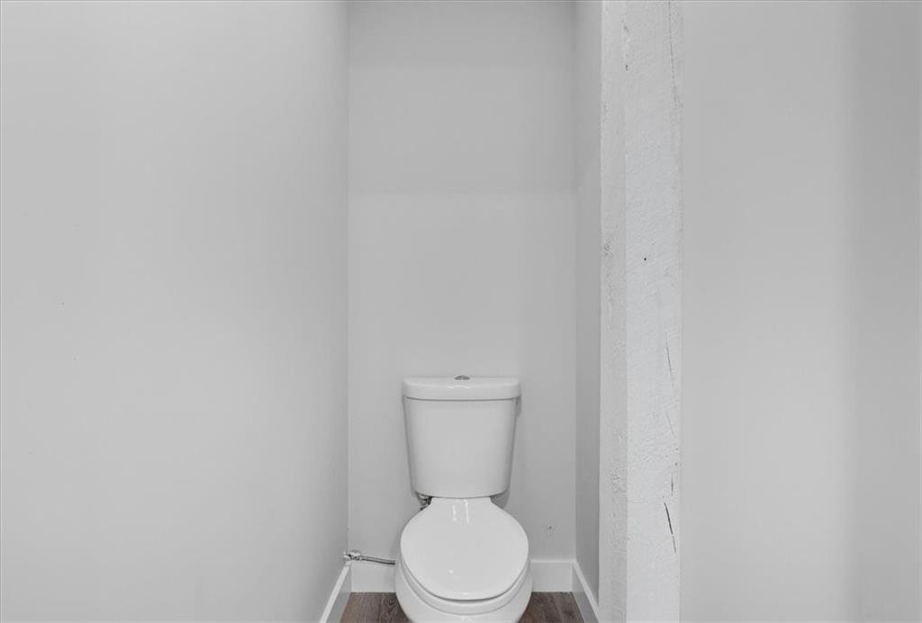 96 Collins Road Rome, GA 30161 - Photo 39 of 57 a white toilet sitting next to a white wall