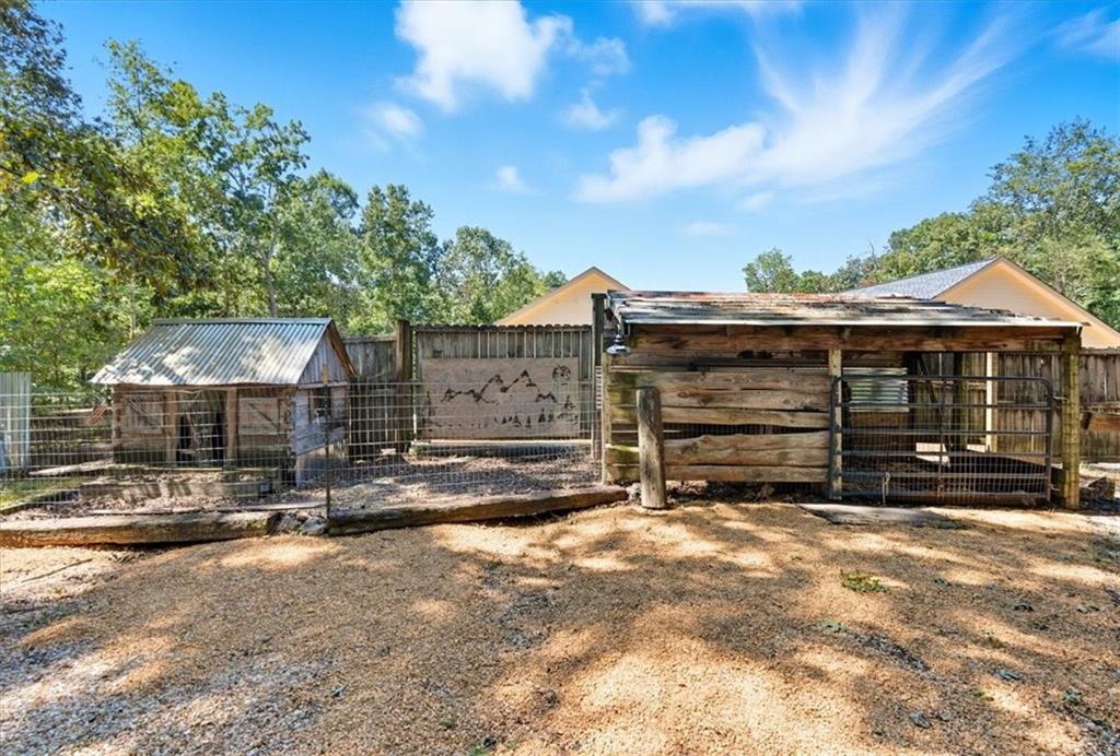 96 Collins Road Rome, GA 30161 - Photo 49 of 57 a view of a house with a yard and garage
