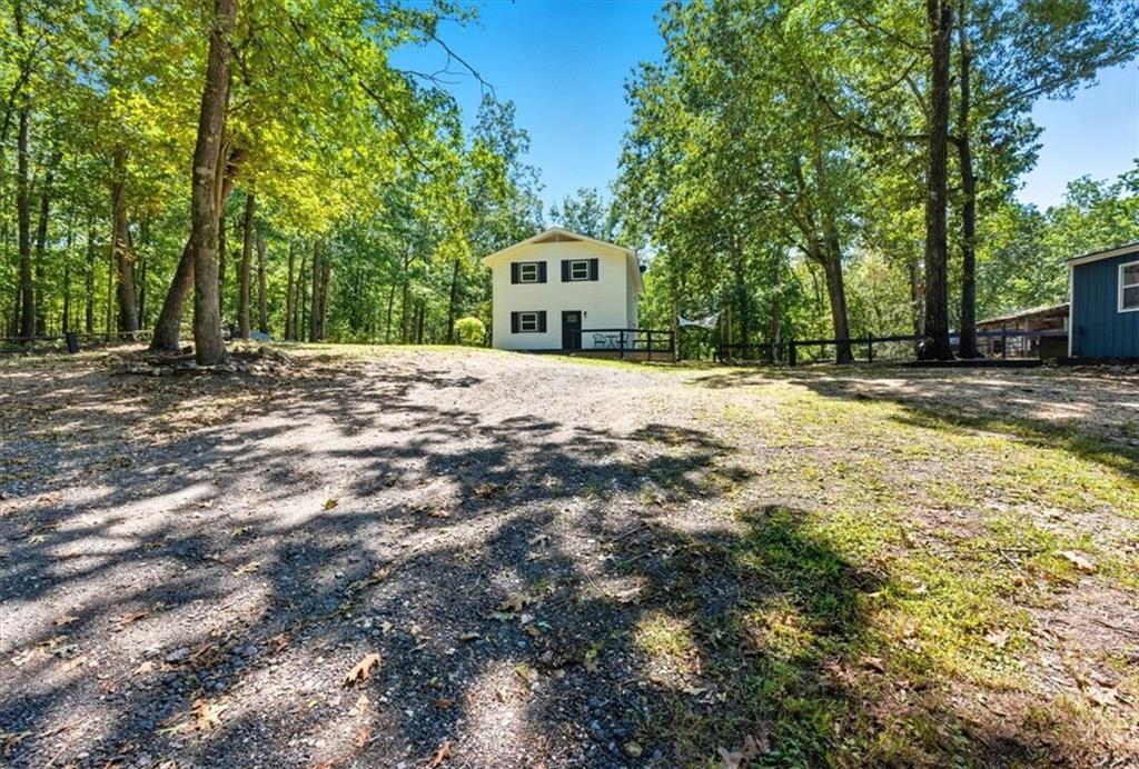 96 Collins Road Rome, GA 30161 - Photo 5 of 57 a white house with a large tree in front of it