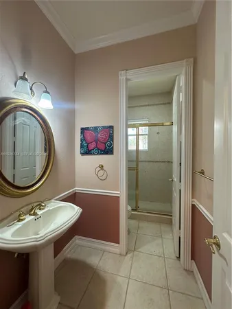 a bathroom with a sink a mirror and a toilet